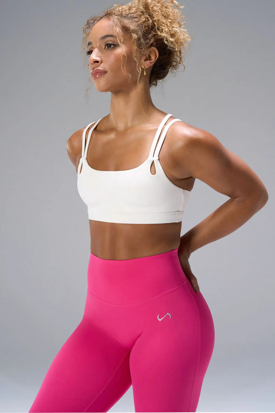 Cream NeoCloud™ Strappy Sports Bra showing side silhouette, medium support, and removable pads by TLF Apparel – side view