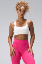 Cream NeoCloud™ Strappy Sports Bra with strappy back and removable pads for everyday wear by TLF Apparel – front view