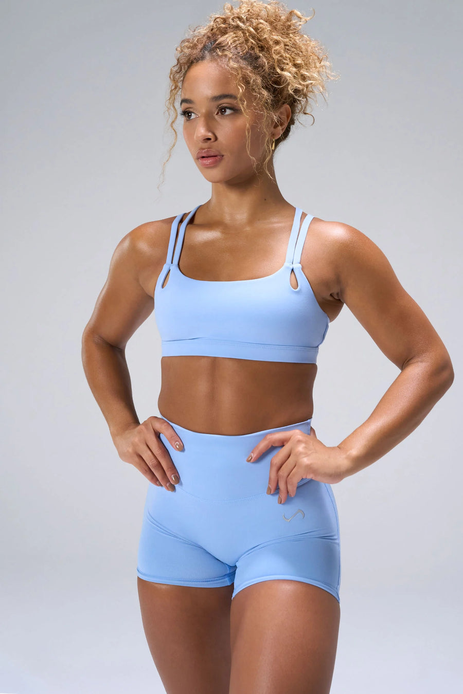 Blue NeoCloud™ Strappy Sports Bra with strappy back and medium support for gym training by TLF Apparel – front view