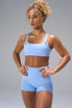 Blue NeoCloud™ Strappy Sports Bra with strappy back and medium support for gym training by TLF Apparel – front view