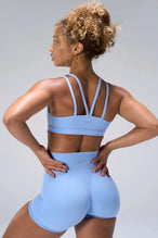 Blue NeoCloud™ Strappy Sports Bra showing strappy back design and breathable cloud-soft fabric by TLF Apparel – back view