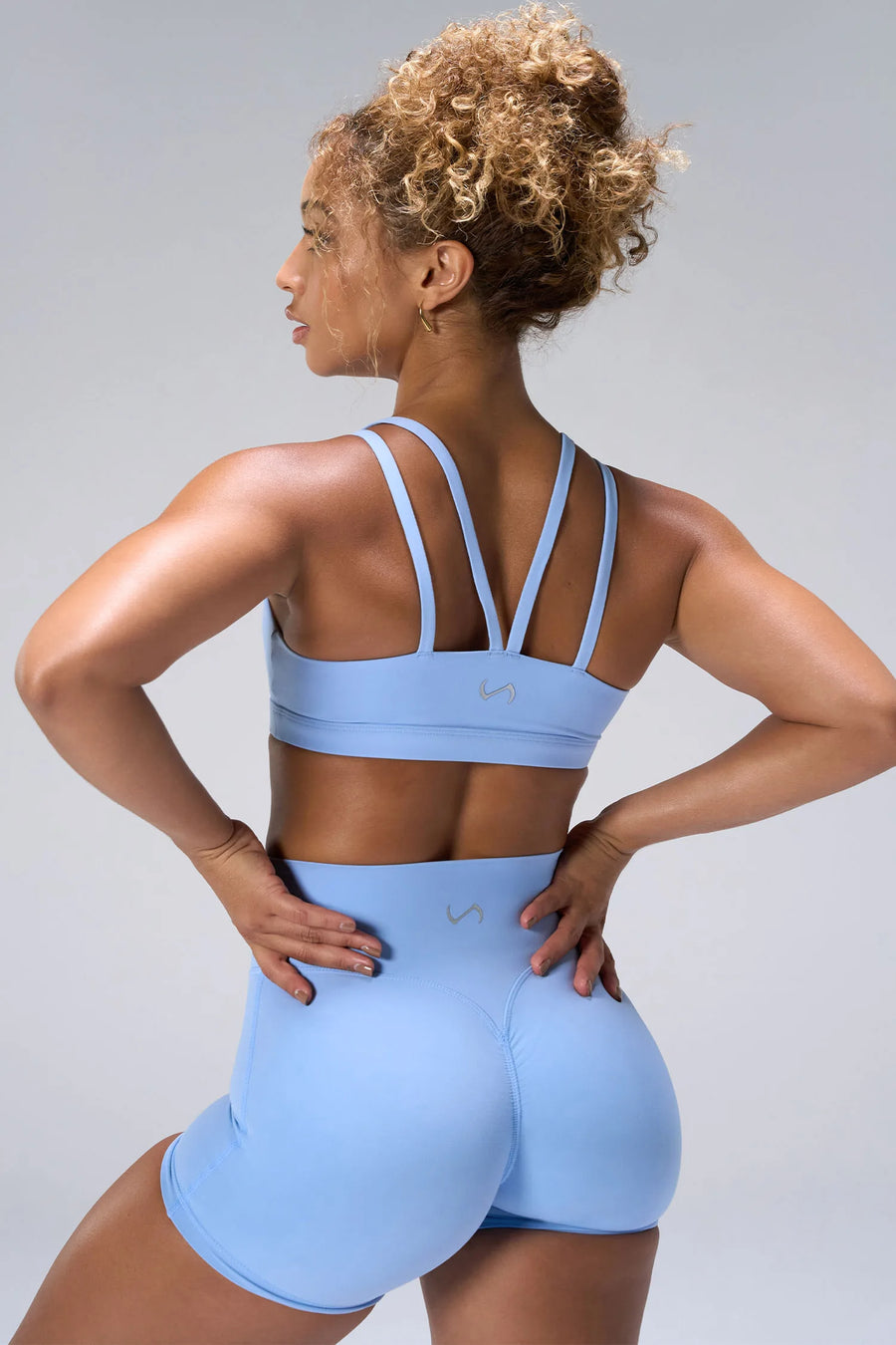 Blue NeoCloud™ Strappy Sports Bra showing strappy back design and breathable cloud-soft fabric by TLF Apparel – back view