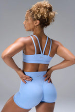 Blue NeoCloud™ Strappy Sports Bra showing strappy back design and breathable cloud-soft fabric by TLF Apparel – back view
