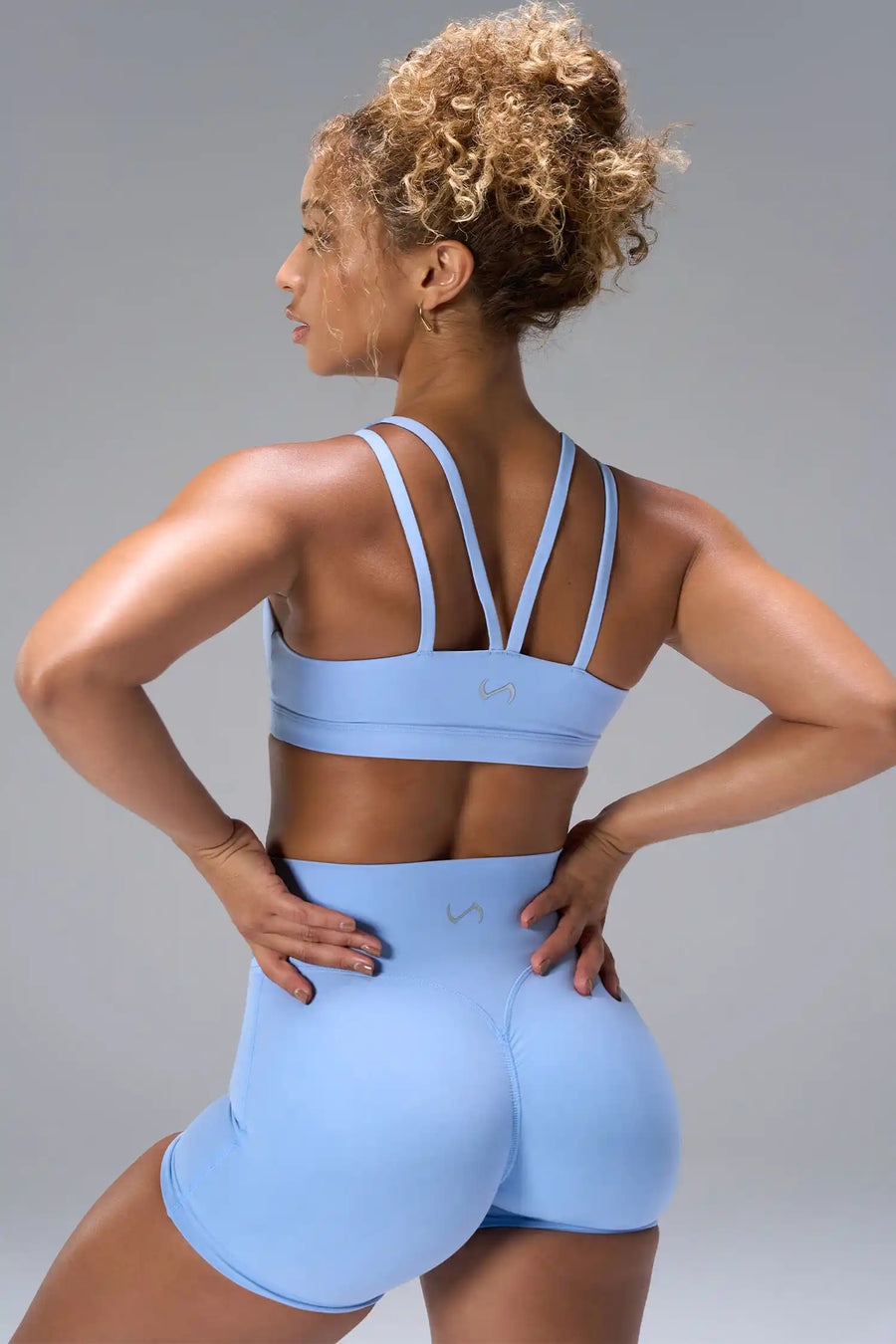 Blue NeoCloud™ Strappy Sports Bra showing strappy back design and breathable cloud-soft fabric by TLF Apparel – back view