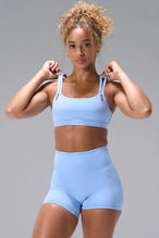Blue NeoCloud™ Strappy Sports Bra with strappy back and removable pads for everyday wear by TLF Apparel – front view