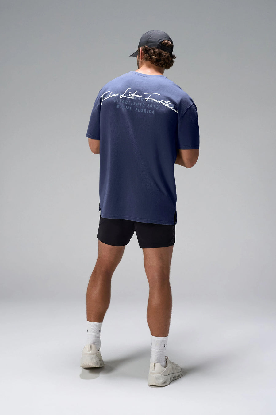 Navy Further Dura Cotton Short Sleeve Tee showing oversized drape and gym-to-street fit by TLF Apparel – back view