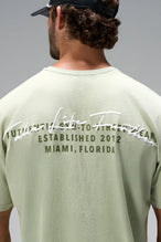 Green Further Dura Cotton Short Sleeve Tee with arched Take Life Further autograph graphic by TLF Apparel – back view