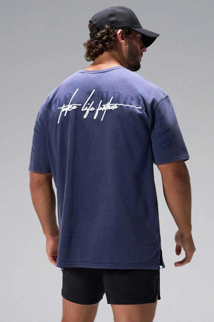 Navy RI Oversized Dura Cotton Short Sleeve Tee showing Redefine Impossible back graphic and oversized fit by TLF Apparel – back view 