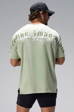 Green RI Oversized Dura Cotton Short Sleeve Tee showing Redefine Impossible back graphic and oversized fit by TLF Apparel – back view 