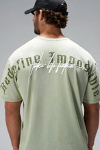 Green RI Oversized Dura Cotton Short Sleeve Tee with Redefine Impossible and Take Life Further back graphic by TLF Apparel – back view