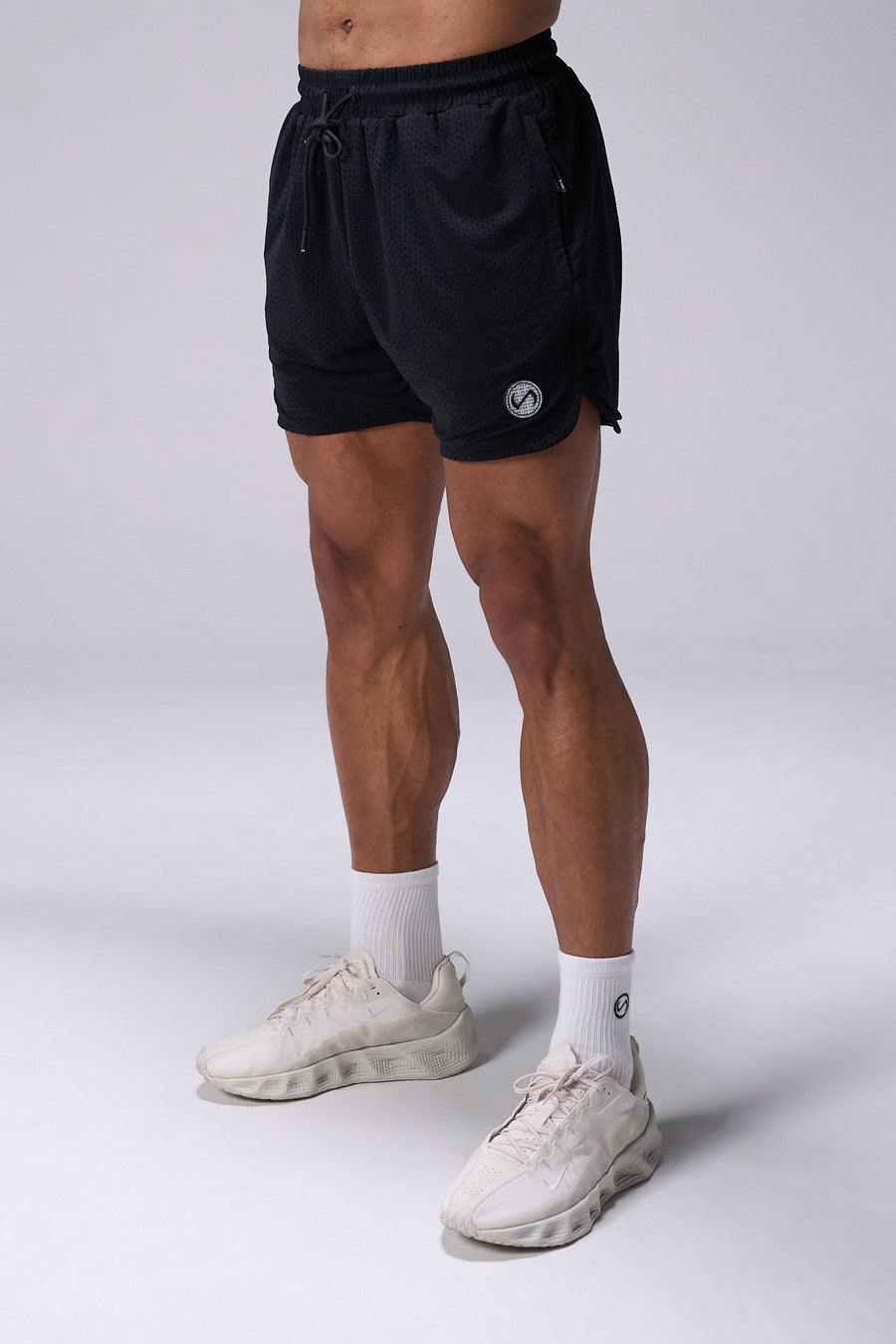 Black Reps Mesh 5 Inch Fitted Shorts with lightweight breathable mesh fabric, zip pockets, and 4-way stretch performance for gym training and workouts by TLF Apparel – front view