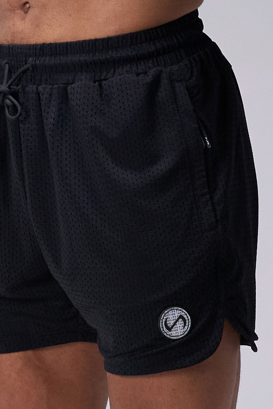 Black Reps Mesh 5 Inch Fitted Shorts showing athletic side silhouette, side split hems, and zip pocket storage by TLF Apparel – side view