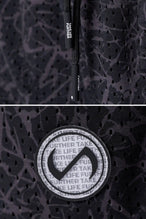 Black Splatter Print Reps Mesh 5 Inch Fitted Shorts showing Mesh Tech DNA™ fabric, side split hem construction, and premium details by TLF Apparel – detail view