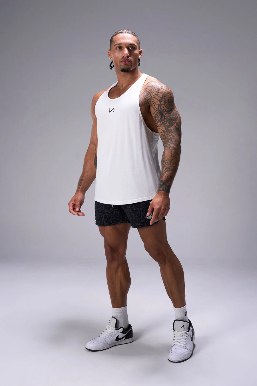 Black Splatter Print Reps Mesh 5 Inch Fitted Shorts showing 5 inch inseam fit, fitted athletic silhouette, and unrestricted mobility by TLF Apparel – side view