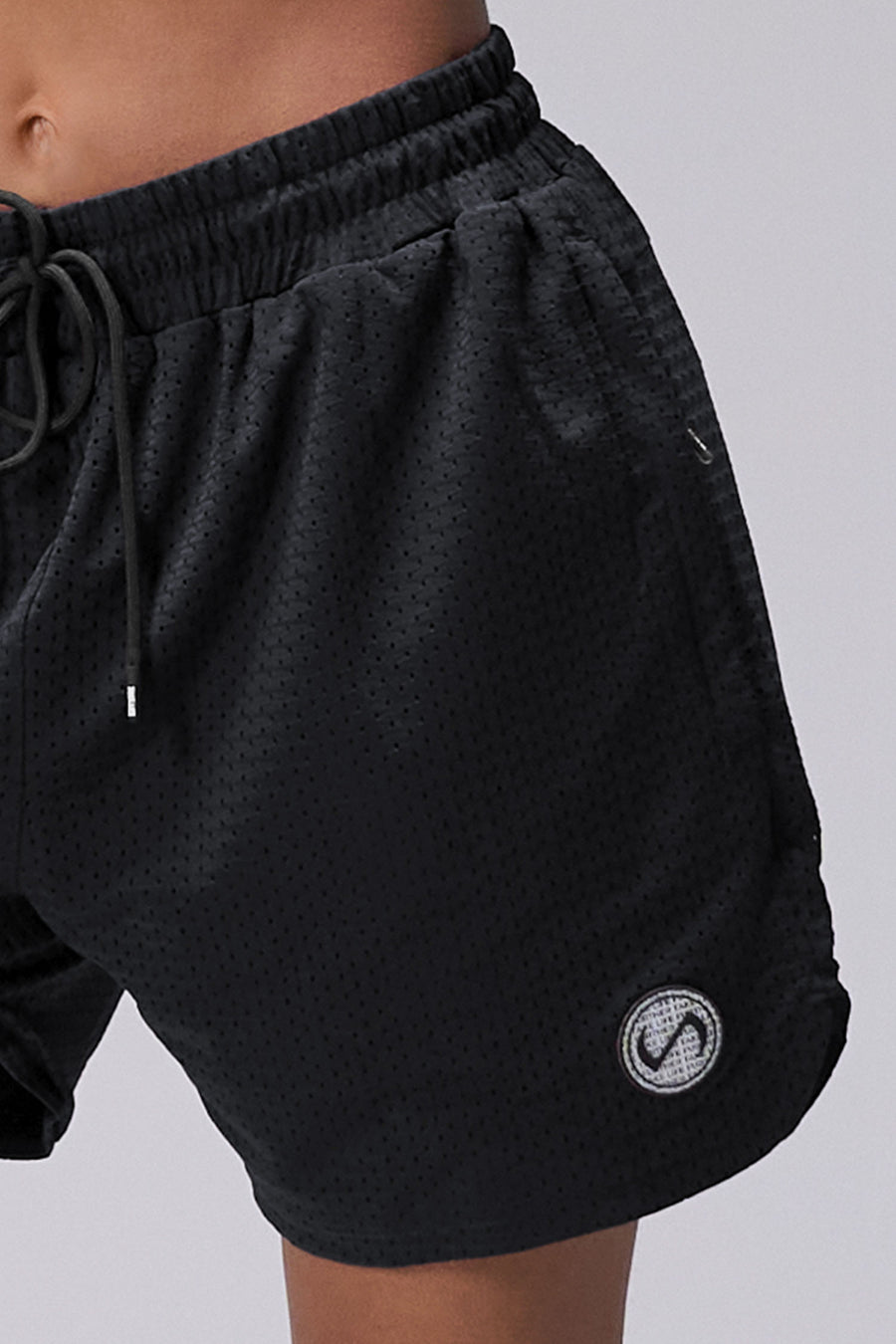 Black Reps Mesh 5 Inch Shorts showing athletic side silhouette, side split hems, and zip pocket storage by TLF Apparel – side view