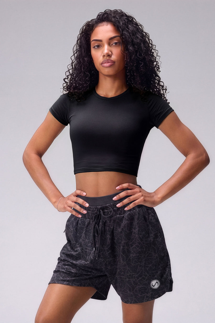 Black Splatter Print Reps Mesh 5 Inch Shorts with athletic silhouette, zip pockets, and lightweight mesh fabric for training by TLF Apparel – front view