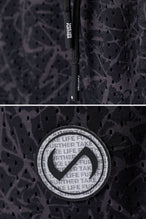 Black Splatter Print Reps Mesh 5 Inch Shorts showing Mesh Tech DNA™ fabric, side split hem construction, and premium details by TLF Apparel – detail view