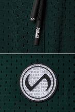 Green Reps Mesh 5 Inch Shorts showing Mesh Tech DNA™ fabric, side split hem construction, and premium details by TLF Apparel – detail view