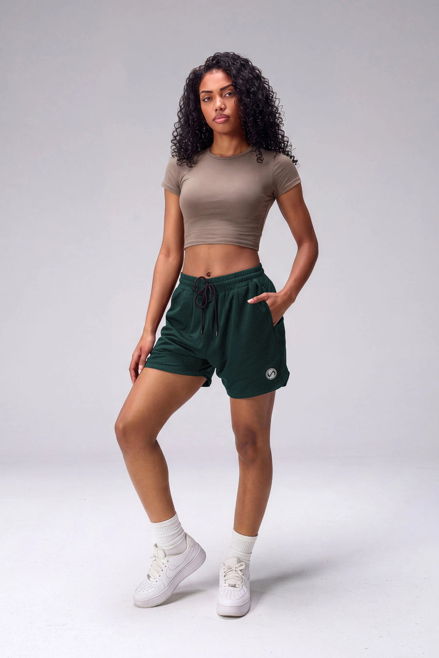 Green Reps Mesh 5 Inch Shorts with lightweight breathable mesh fabric, zip pockets, and 4-way stretch performance for gym training and workouts by TLF Apparel – front view