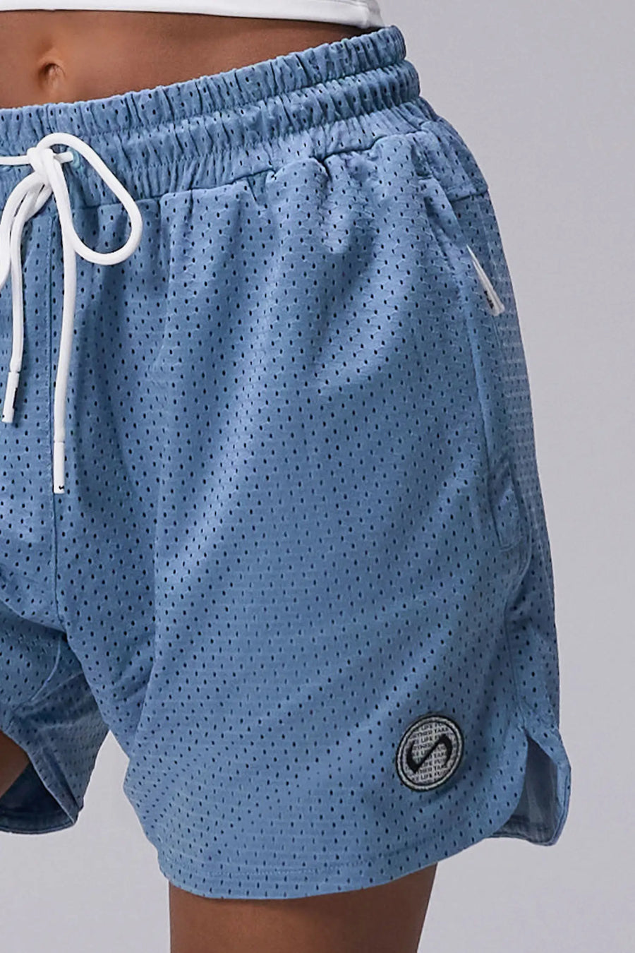 Light Blue Reps Mesh 5 Inch Shorts showing Mesh Tech DNA™ fabric, side split hem construction, and premium details by TLF Apparel – detail view