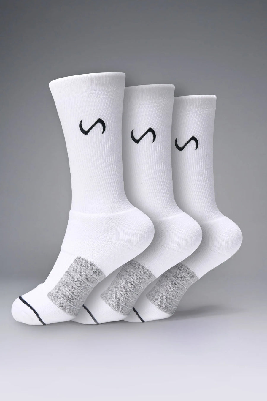 3 pack White Unisex Performance Crew Socks with medium cushioning, targeted compression, and jacquard foot mapping for support and comfort by TLF Apparel – side view 