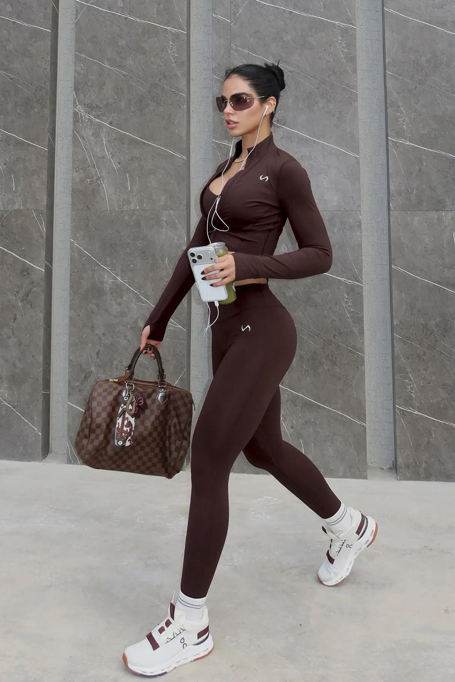Front View of Brown TLF Tempo Cropped Zip Up Jacket featuring thumbholes and cropped length for gym and lifestyle wear 