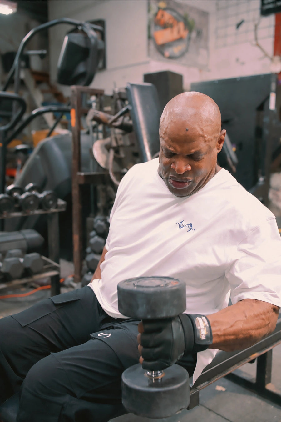 White Ronnie Coleman “Light weight baby” Tee showing Ronnie Coleman x TLF chest logo and ultra-soft Cotton Luxe DNA™ fabric by TLF Apparel – front view