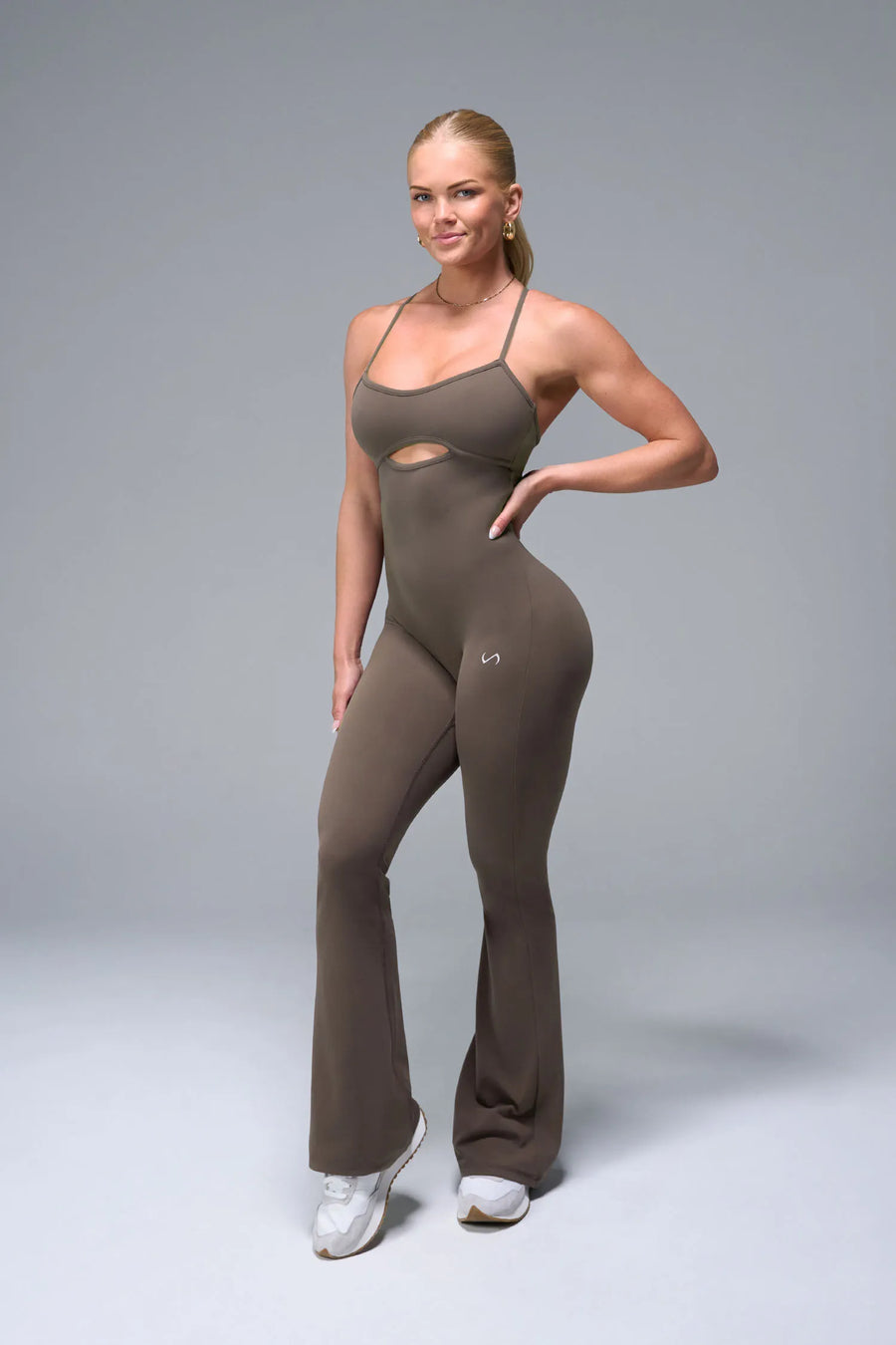 Front View of Brown TLF NeoCloud™ Flare Jumpsuit featuring a built-in low support sports bra with removable pads and adjustable straps