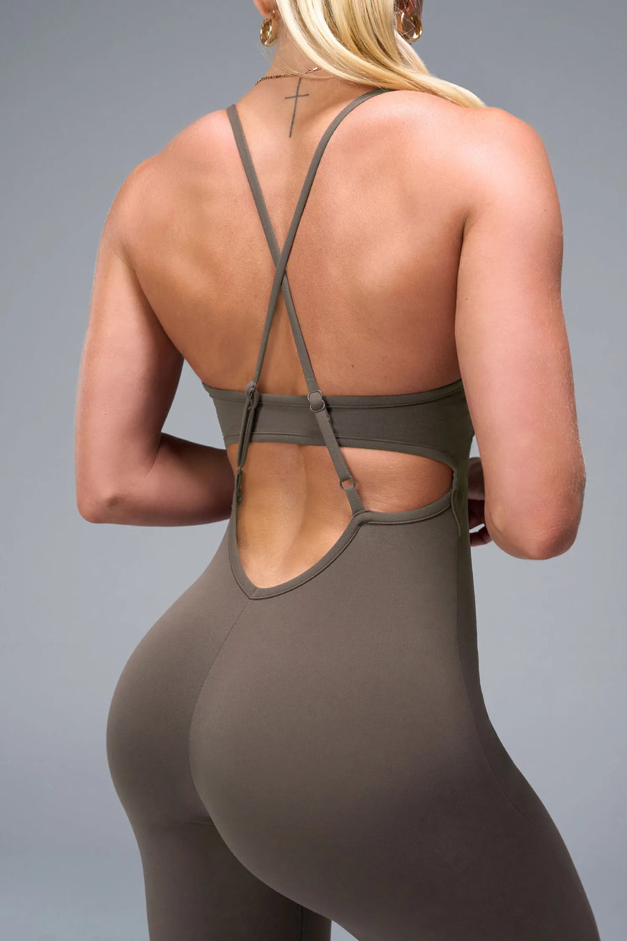 Back View of Brown TLF NeoCloud™ Flare Jumpsuit featuring a built-in low support sports bra with removable pads and adjustable straps