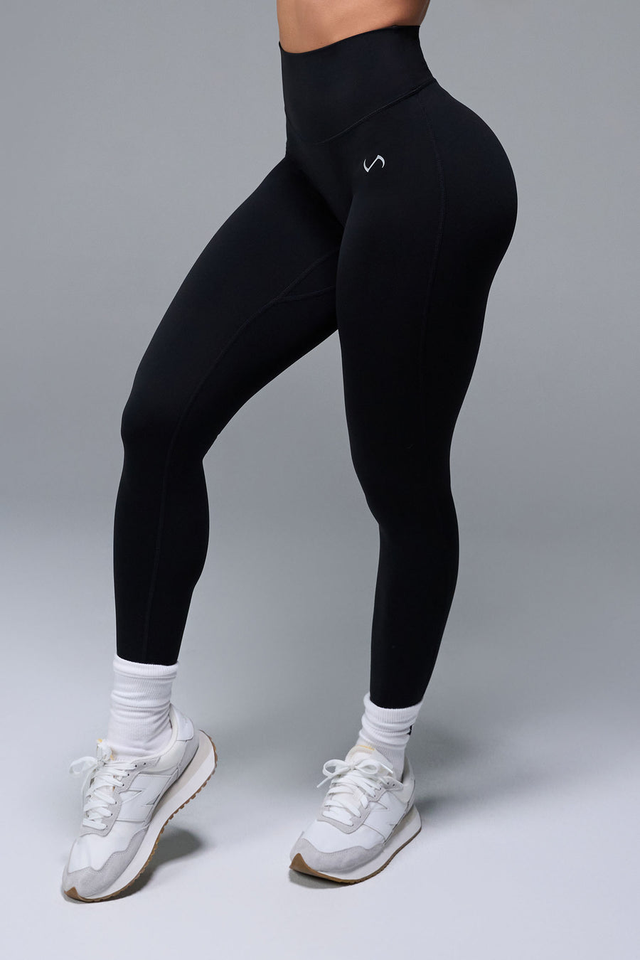 Front View of Black TLF NeoCloud™ Secret Glute Seam Leggings featuring our new secret glute seam technology to lift and shape your glutes. 