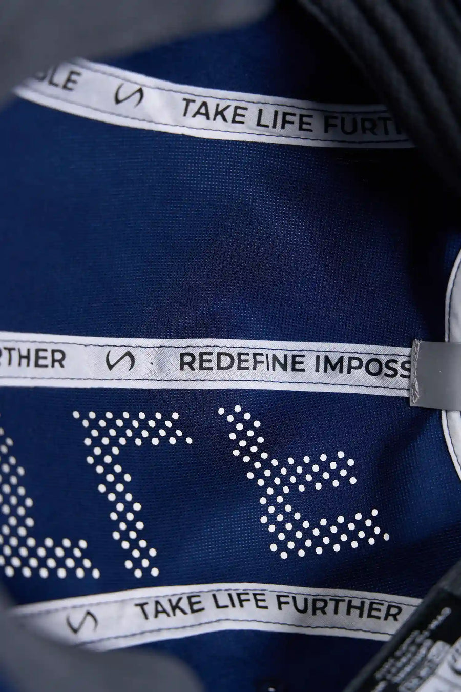 Blue Storm Pluma Packable Hat showing laser perforated crown panel and lightweight ripstop fabric detail by TLF Apparel – detail view 