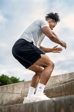 Black Adapt Performance 7 Inch Shorts with durable 4-way stretch performance fabric and secure zipper pockets for training and gym workouts by TLF Apparel – side view