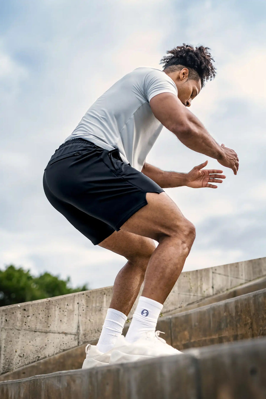 Black Adapt Performance 7 Inch Shorts with durable 4-way stretch performance fabric and secure zipper pockets for training and gym workouts by TLF Apparel – side view