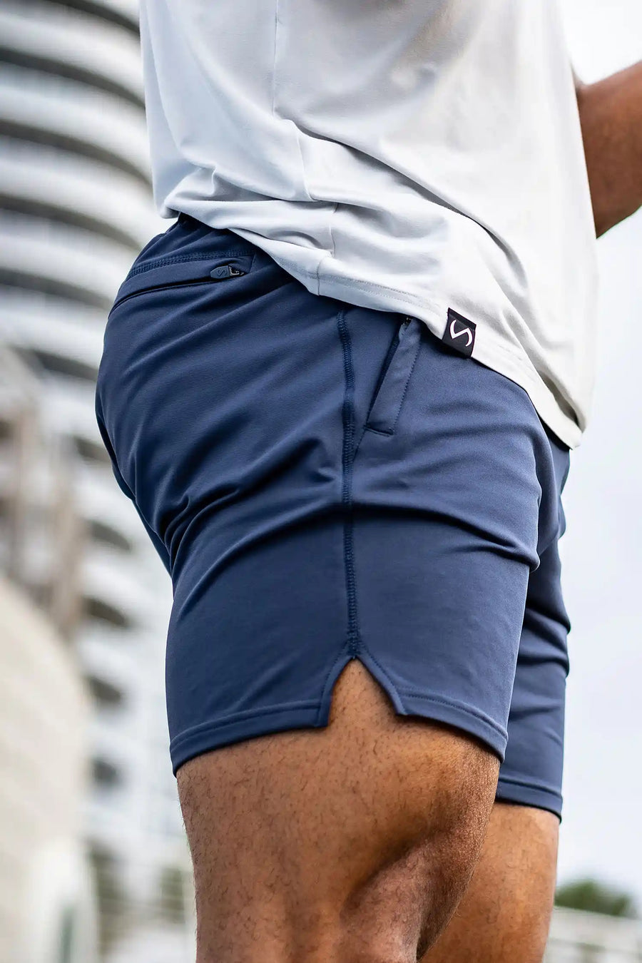 Blue Adapt Performance 7 Inch Shorts with durable 4-way stretch performance fabric and secure zipper pockets for training and gym workouts by TLF Apparel – side view 