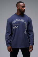 Front View Of Blue Stonewash TLF Arc Dura Cotton Oversized Long Sleeve