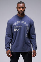 Front View Of Blue Stonewash TLF Arc Dura Cotton Oversized Long Sleeve