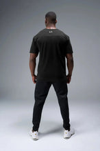 Back View of Black TLF Athletic Dept Cotton Luxe Oversized Tee featuring a bold 2 one graphic print design across the chest in our oversized shirt fit