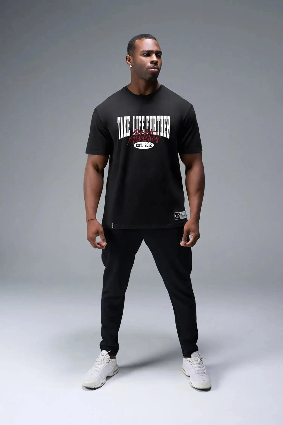 Front View of Black TLF Athletic Dept Cotton Luxe Oversized Tee featuring a bold 2 one graphic print design across the chest in our oversized shirt fit