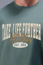 Front View of Green TLF Athletic Dept Cotton Luxe Oversized Tee featuring a bold 2 one graphic print design across the chest in our oversized shirt fit