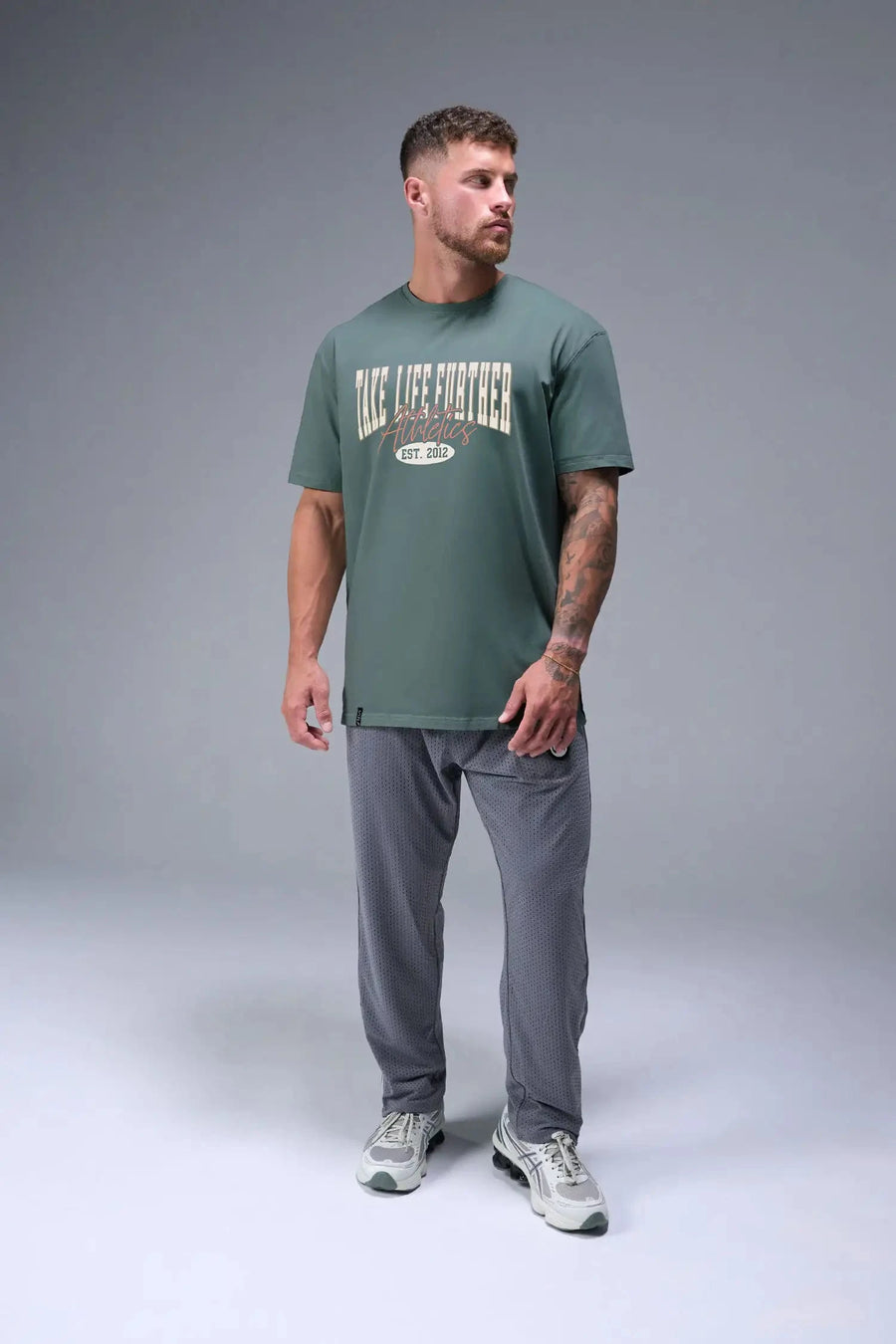 Front View of Green TLF Athletic Dept Cotton Luxe Oversized Tee featuring a bold 2 one graphic print design across the chest in our oversized shirt fit