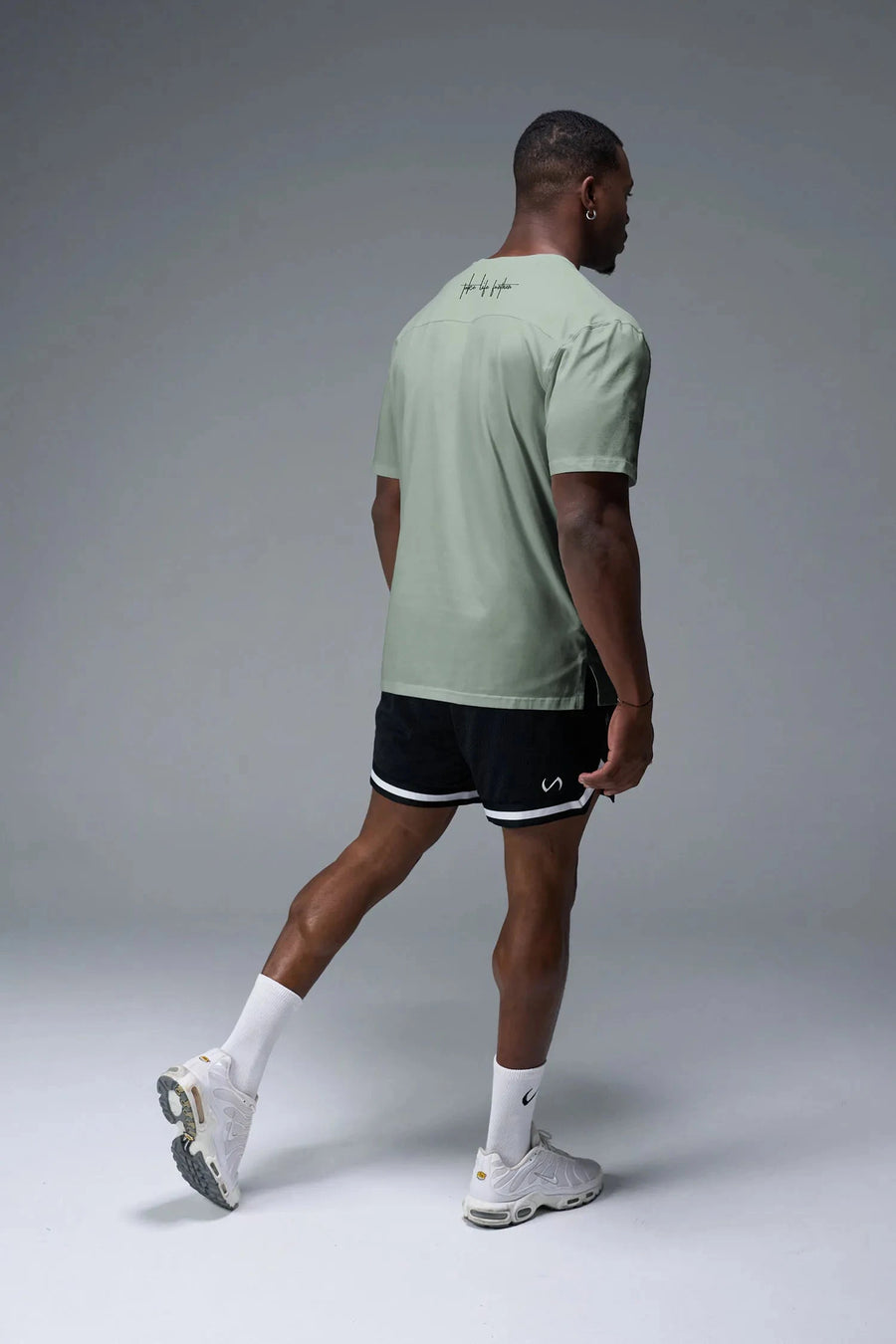 Side View Of Back Script Oversized Tee in Green