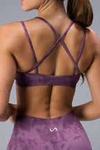 Back View of Purple TLF Cosmic Seamless Strappy Sports, featuring medium impact support and a strappy back design 