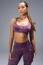 Front View of Purple TLF Cosmic Seamless Strappy Sports, featuring medium impact support and a strappy back design 