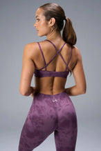 Back View of Purple TLF Cosmic Seamless Strappy Sports, featuring medium impact support and a strappy back design 