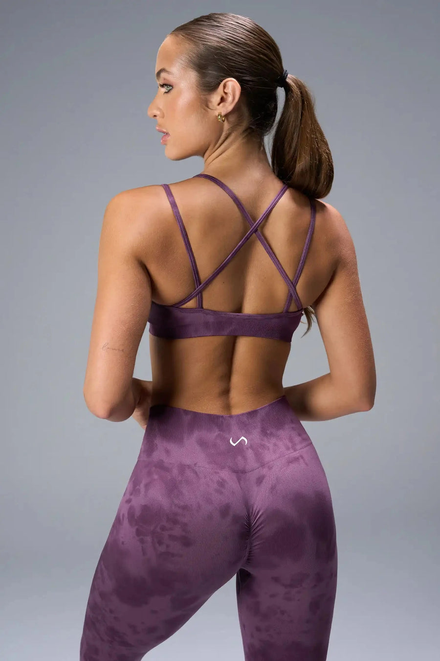 Back View of Purple TLF Cosmic Seamless Strappy Sports, featuring medium impact support and a strappy back design 