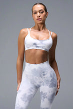 Front View of White TLF Cosmic Seamless Strappy Sports, featuring medium impact support and a strappy back design 