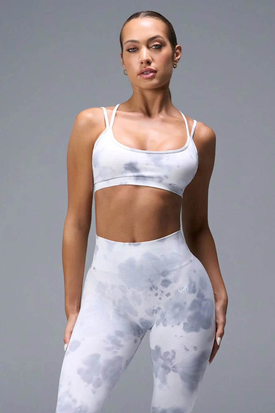 Front View of White TLF Cosmic Seamless Strappy Sports, featuring medium impact support and a strappy back design 