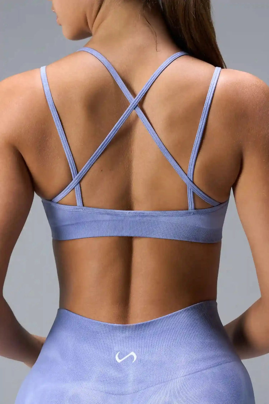 Back View of Blue TLF Cosmic Seamless Strappy Sports, featuring medium impact support and a strappy back design 