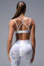 Back View of White TLF Cosmic Seamless Strappy Sports, featuring medium impact support and a strappy back design 