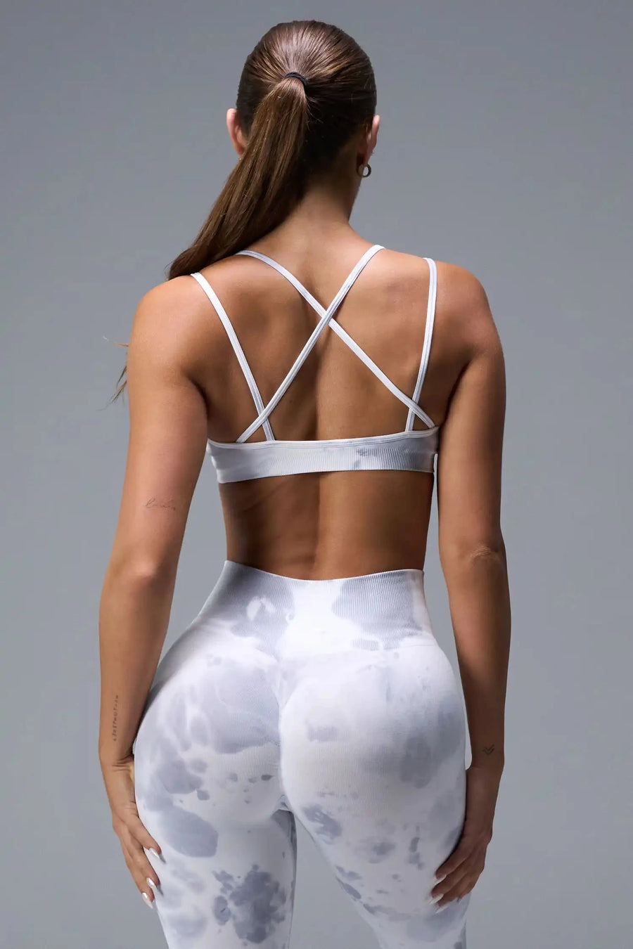 Back View of White TLF Cosmic Seamless Strappy Sports, featuring medium impact support and a strappy back design 